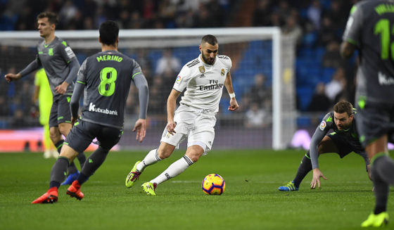 Real Madrid's French forward Karim Benzema (C) dribbles the ball during the Spanish League football match between Real Madrid CF and Real Sociedad at the Santiago Bernabeu stadium in Madrid on January 6, 2019. (Photo by GABRIEL BOUYS / AFP) (Photo credit should read GABRIEL BOUYS/AFP/Getty Images)