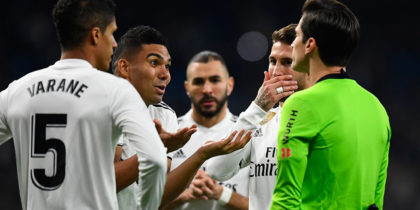 Real Madrid's Brazilian midfielder Casemiro (2L) and teammates protest to Spanish referee Jose Luis Munuera during the Spanish League football match between Real Madrid CF and Real Sociedad at the Santiago Bernabeu stadium in Madrid on January 6, 2019. (Photo by GABRIEL BOUYS / AFP) (Photo credit should read GABRIEL BOUYS/AFP/Getty Images)