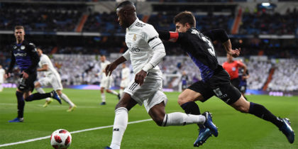 MADRID, SPAIN - JANUARY 09: Vinicius Junior of Real Madrid CF gets past Unai Bustinza of CD Leganes during the Copa del Rey Round of 16 match between Real Madrid CF and CD Leganes at estadio Santiago Bernabeu on January 09, 2019 in Madrid, Spain. (Photo by Denis Doyle/Getty Images)