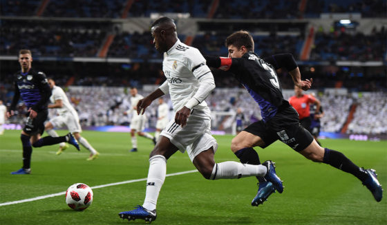 MADRID, SPAIN - JANUARY 09: Vinicius Junior of Real Madrid CF gets past Unai Bustinza of CD Leganes during the Copa del Rey Round of 16 match between Real Madrid CF and CD Leganes at estadio Santiago Bernabeu on January 09, 2019 in Madrid, Spain. (Photo by Denis Doyle/Getty Images)