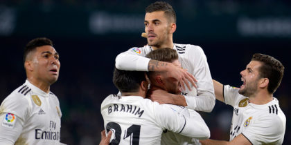 Real Madrid's Spanish midfielder Daniel Ceballos (C) celebrates after scoring a goal during the Spanish League football match between Real Betis and Real Madrid CF at the Benito Villamarin stadium in Seville on January 13, 2019. (Photo by CRISTINA QUICLER / AFP) (Photo credit should read CRISTINA QUICLER/AFP/Getty Images)