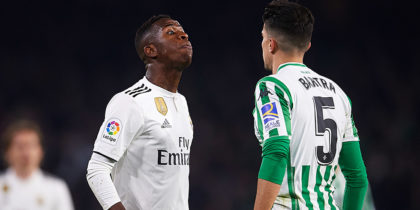 SEVILLE, SPAIN - JANUARY 13: Vinicius Jr of Real Madrid CF (L) discuss with Marc Bartra of Real Betis Balompie (R) during the La Liga match between Real Betis Balompie and Real Madrid CF at Estadio Benito Villamarin on January 13, 2019 in Seville, Spain. (Photo by Aitor Alcalde/Getty Images)