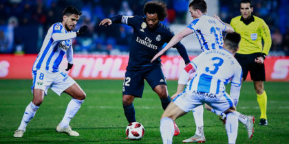 LEGANES, SPAIN - JANUARY 16: Marcelo (2ndL) of Real Madrid CF competes for the ball with Jose Luis edel Pozo alias Recio (L) and Javier Eraso (R) of Deportivo Leganes during the Copa del Rey Round of 16 second leg match between CD Leganes and Real Madrid at Estadio Municipal de Butarque on January 16, 2019 in Leganes, Spain. (Photo by Gonzalo Arroyo Moreno/Getty Images)