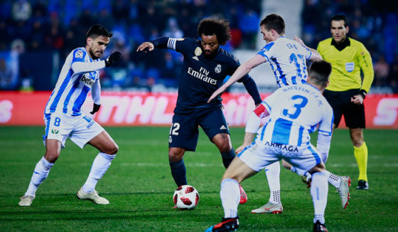 LEGANES, SPAIN - JANUARY 16: Marcelo (2ndL) of Real Madrid CF competes for the ball with Jose Luis edel Pozo alias Recio (L) and Javier Eraso (R) of Deportivo Leganes during the Copa del Rey Round of 16 second leg match between CD Leganes and Real Madrid at Estadio Municipal de Butarque on January 16, 2019 in Leganes, Spain. (Photo by Gonzalo Arroyo Moreno/Getty Images)