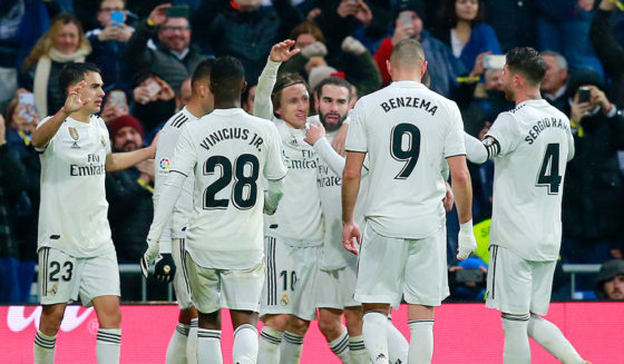 MADRID, SPAIN - JANUARY 19: Luka Modric of Real Madrid celebrates with teammates after scoring his sides second goal during the La Liga match between Real Madrid CF and Sevilla FC at Estadio Santiago Bernabeu on January 19, 2019 in Madrid, Spain. (Photo by Gonzalo Arroyo Moreno/Getty Images)
