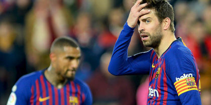 Barcelona's Spanish defender Gerard Pique (R) reacts to Sevilla's goal during the Spanish Copa del Rey (King's Cup) quarter-final first leg football match between Sevilla FC and FC Barcelona at the Ramon Sanchez Pizjuan stadium in Seville on January 23, 2019. (Photo by CRISTINA QUICLER / AFP) (Photo credit should read CRISTINA QUICLER/AFP/Getty Images)