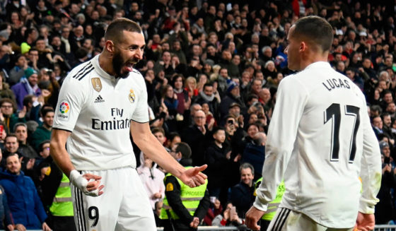 Real Madrid's French forward Karim Benzema (L) celebrates with Real Madrid's Spanish midfielder Lucas Vazquez after scoring during the Spanish Copa del Rey (King's Cup) quarter-final first leg football match between Real Madrid CF and Girona FC at the Santiago Bernabeu stadium in Madrid on January 24, 2019. (Photo by JAVIER SORIANO / AFP) (Photo credit should read JAVIER SORIANO/AFP/Getty Images)