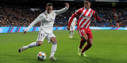MADRID, SPAIN - JANUARY 24: Lucas Vazquez (L) of Real Madrid CF kicks the ball against Douglas Luiz (R) of Girona FC during the Copa del Rey Quarter Final match between Real Madrid CF and Girona FC at Estadio Santiago Bernabeu on January 24, 2019 in Madrid, Spain. (Photo by Gonzalo Arroyo Moreno/Getty Images)