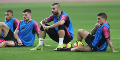 (From L) Paris Saint-Germain's French forward Kylian Mbappe, Paris Saint-Germain's Belgian defender Thomas Meunier, Paris Saint-Germain's Spanish forward Jese Rodriguez and Paris Saint-Germain's Italian midfielder Marco Verratti sit watching during their winter training camp at the Khalifa International Stadium in the Qatari capital Doha on January 15, 2019. (Photo by Karim JAAFAR / AFP) (Photo credit should read KARIM JAAFAR/AFP/Getty Images)
