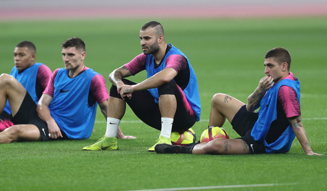 (From L) Paris Saint-Germain's French forward Kylian Mbappe, Paris Saint-Germain's Belgian defender Thomas Meunier, Paris Saint-Germain's Spanish forward Jese Rodriguez and Paris Saint-Germain's Italian midfielder Marco Verratti sit watching during their winter training camp at the Khalifa International Stadium in the Qatari capital Doha on January 15, 2019. (Photo by Karim JAAFAR / AFP) (Photo credit should read KARIM JAAFAR/AFP/Getty Images)