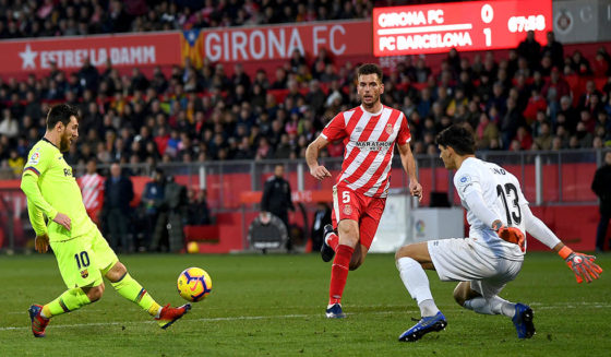 GIRONA, SPAIN - JANUARY 27: Lionel Messi of Barcelona scores his team's second goal past Yassine Bounou of Girona as Pedro Alcala of Girona reacts during the La Liga match between Girona FC and FC Barcelona at Montilivi Stadium on January 27, 2019 in Girona, Spain. (Photo by David Ramos/Getty Images)