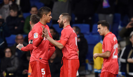 BARCELONA, SPAIN - JANUARY 27: Karim Benzema of Real Madrid celebrates with teammates after scoring his team's first goal during the La Liga match between RCD Espanyol and Real Madrid CF at RCDE Stadium on January 27, 2019 in Barcelona, Spain. (Photo by Alex Caparros/Getty Images)