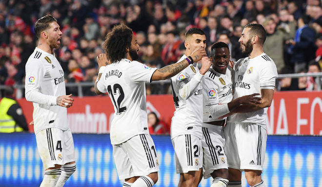 GIRONA, SPAIN - JANUARY 31: Karim Benzema of Real Madrid celebrates scoring to make it 2-0 with team mates during the Copa del Quarter Final match between Girona and Real Madrid at Montilivi Stadium on January 31, 2019 in Girona, Spain. (Photo by David Ramos/Getty Images )