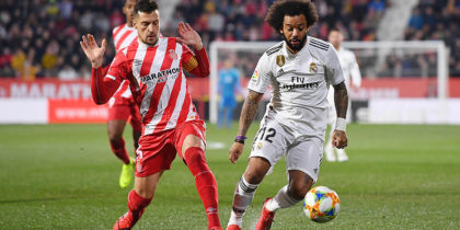 GIRONA, SPAIN - JANUARY 31: Alex Granell of Girona and Marcelo of Real Madrid in action during the Copa del Quarter Final match between Girona and Real Madrid at Montilivi Stadium on January 31, 2019 in Girona, Spain. (Photo by David Ramos/Getty Images )