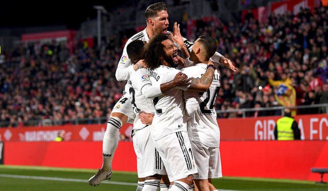 GIRONA, SPAIN - JANUARY 31: Karim Benzema of Real Madrid celebrates scoring to make it 2-0 with team mates during the Copa del Quarter Final match between Girona and Real Madrid at Montilivi Stadium on January 31, 2019 in Girona, Spain. (Photo by David Ramos/Getty Images )