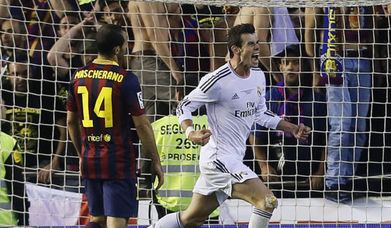 Real Madrid's Welsh forward Gareth Bale (R) celebrates after scoring during the Spanish Copa del Rey (King's Cup) final "Clasico" football match FC Barcelona vs Real Madrid CF at the Mestalla stadium in Valencia on April 16, 2014. AFP PHOTO / CESAR MANSO (Photo credit should read CESAR MANSO/AFP/Getty Images)