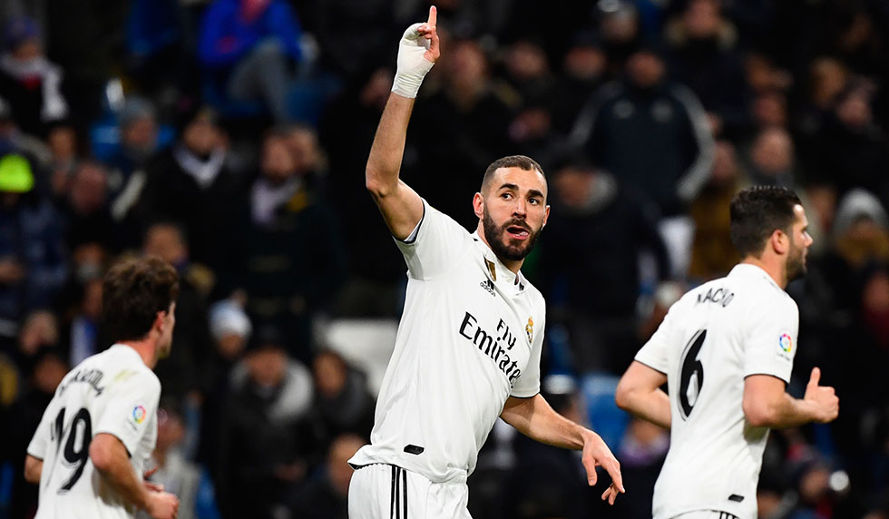 Real Madrid's French forward Karim Benzema celebrates scoring the opening goal during the Spanish league football match Real Madrid CF against Club Deportivo Alaves at the Santiago Bernabeu stadium in Madrid on February 3, 2019. (Photo by GABRIEL BOUYS / AFP) (Photo credit should read GABRIEL BOUYS/AFP/Getty Images)