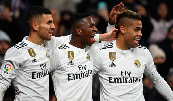 Real Madrid's Brazilian forward Vinicius Junior (C) celebrates his goal with Real Madrid's Spanish midfielder Daniel Ceballos (L) and Real Madrid's Spanish-Dominican forward Mariano during the Spanish league football match Real Madrid CF against Club Deportivo Alaves at the Santiago Bernabeu stadium in Madrid on February 3, 2019. (Photo by GABRIEL BOUYS / AFP) (Photo credit should read GABRIEL BOUYS/AFP/Getty Images)