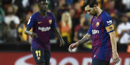 Barcelona's Argentinian forward Lionel Messi (R) looks downwards beside Barcelona's French forward Ousmane Dembele during the Spanish league football match between Valencia CF and FC Barcelona at the Mestalla stadium in Valencia on October 7, 2018. (Photo by JOSE JORDAN / AFP) (Photo credit should read JOSE JORDAN/AFP/Getty Images)