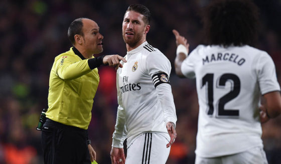 BARCELONA, SPAIN - FEBRUARY 06: Sergio Ramos of Real Madrid CF is shown a yellow card by the referee Mateu Lahoz during the Copa del Semi Final first leg match between Barcelona and Real Madrid at Nou Camp on February 06, 2019 in Barcelona, Spain. (Photo by Alex Caparros/Getty Images)