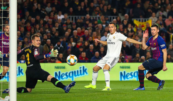 BARCELONA, SPAIN - FEBRUARY 06: Lucas Vazquez of Real Madrid CF scores his team's first goal past Marc-Andre ter Stegen (L) and Clement Lenglet of FC Barcelona during the Copa del Semi Final first leg match between Barcelona and Real Madrid at Nou Camp on February 06, 2019 in Barcelona, Spain. (Photo by Angel Martinez/Getty Images)