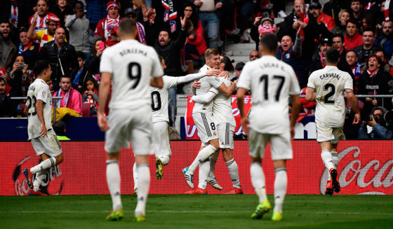 Real Madrid's Welsh forward Gareth Bale (C) celebrates with teammates after scloring during the Spanish league football match Club Atletico de Madrid against Real Madrid CF at the Wanda Metropolitano stadium in Madrid on February 9, 2019. (Photo by PIERRE-PHILIPPE MARCOU / AFP) (Photo credit should read PIERRE-PHILIPPE MARCOU/AFP/Getty Images)