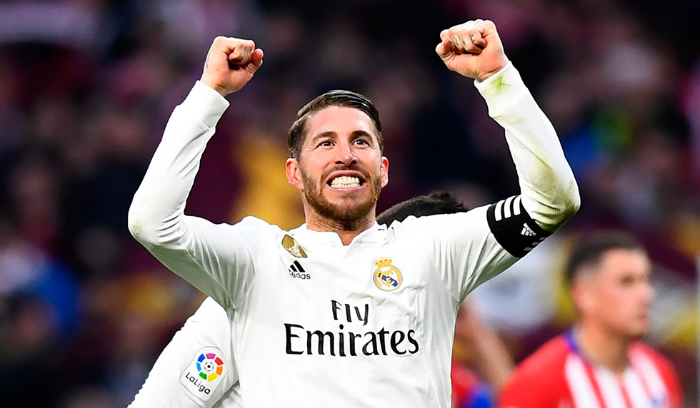 Real Madrid's Spanish defender Sergio Ramos celebrates at the end of the Spanish league football match between Club Atletico de Madrid and Real Madrid CF at the Wanda Metropolitano stadium in Madrid on February 9, 2019. (Photo by GABRIEL BOUYS / AFP) (Photo credit should read GABRIEL BOUYS/AFP/Getty Images)
