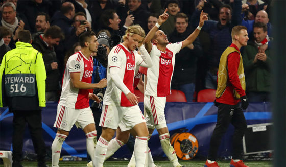 AMSTERDAM, NETHERLANDS - FEBRUARY 13: Hakim Ziyech of Ajax celebrates after scoring his team's first goal with his team mates during the UEFA Champions League Round of 16 First Leg match between Ajax and Real Madrid at Johan Cruyff Arena on February 13, 2019 in Amsterdam, Netherlands. (Photo by Dean Mouhtaropoulos/Getty Images)