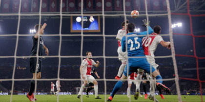 AMSTERDAM, NETHERLANDS - FEBRUARY 13: Nicolas Tagliafico of Ajax scores his team's first goal past Thibaut Courtois of Real Madrid but it is later disallowed by VAR during the UEFA Champions League Round of 16 First Leg match between Ajax and Real Madrid at Johan Cruyff Arena on February 13, 2019 in Amsterdam, Netherlands. (Photo by Lars Baron/Getty Images)