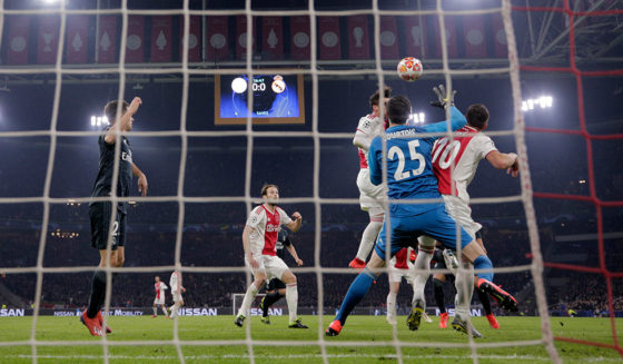 AMSTERDAM, NETHERLANDS - FEBRUARY 13: Nicolas Tagliafico of Ajax scores his team's first goal past Thibaut Courtois of Real Madrid but it is later disallowed by VAR during the UEFA Champions League Round of 16 First Leg match between Ajax and Real Madrid at Johan Cruyff Arena on February 13, 2019 in Amsterdam, Netherlands. (Photo by Lars Baron/Getty Images)