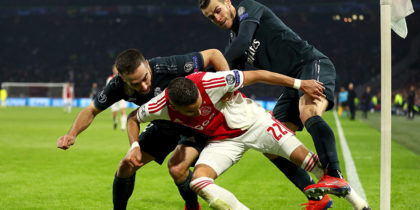AMSTERDAM, NETHERLANDS - FEBRUARY 13: Hakim Ziyech of Ajax is challenged by Daniel Carvajal of Real Madrid and Gareth Bale of Real Madrid during the UEFA Champions League Round of 16 First Leg match between Ajax and Real Madrid at Johan Cruyff Arena on February 13, 2019 in Amsterdam, Netherlands. (Photo by Lars Baron/Getty Images)