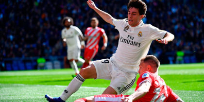 Real Madrid's Spanish defender Alvaro Odriozola (back) challenges Girona's Spanish defender Raul Garcia during the Spanish League football match between Real Madrid and Girona at the Santiago Bernabeu stadium in Madrid on February 17, 2019. (Photo by GABRIEL BOUYS / AFP) (Photo credit should read GABRIEL BOUYS/AFP/Getty Images)