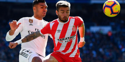 Real Madrid's Brazilian midfielder Casemiro challenges Girona's Spanish midfielder Portu (R) during the Spanish League football match between Real Madrid and Girona at the Santiago Bernabeu stadium in Madrid on February 17, 2019. (Photo by GABRIEL BOUYS / AFP) (Photo credit should read GABRIEL BOUYS/AFP/Getty Images)