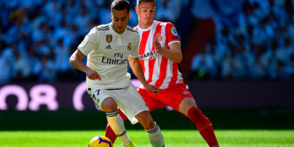 Real Madrid's Spanish midfielder Lucas Vazquez (L) challenges Girona's Spanish defender Raul Garcia during the Spanish League football match between Real Madrid and Girona at the Santiago Bernabeu stadium in Madrid on February 17, 2019. (Photo by GABRIEL BOUYS / AFP) (Photo credit should read GABRIEL BOUYS/AFP/Getty Images)
