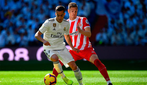 Real Madrid's Spanish midfielder Lucas Vazquez (L) challenges Girona's Spanish defender Raul Garcia during the Spanish League football match between Real Madrid and Girona at the Santiago Bernabeu stadium in Madrid on February 17, 2019. (Photo by GABRIEL BOUYS / AFP) (Photo credit should read GABRIEL BOUYS/AFP/Getty Images)