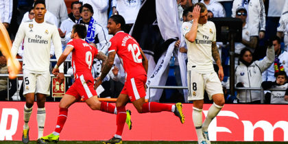 Real Madrid's French defender Raphael Varane (L) and Real Madrid's German midfielder Toni Kroos (C) react as Girona's Spanish midfielder Portu (2ndL) celebrates with teammates after scoring his team's second goal during the Spanish League football match between Real Madrid and Girona at the Santiago Bernabeu stadium in Madrid on February 17, 2019. (Photo by GABRIEL BOUYS / AFP) (Photo credit should read GABRIEL BOUYS/AFP/Getty Images)
