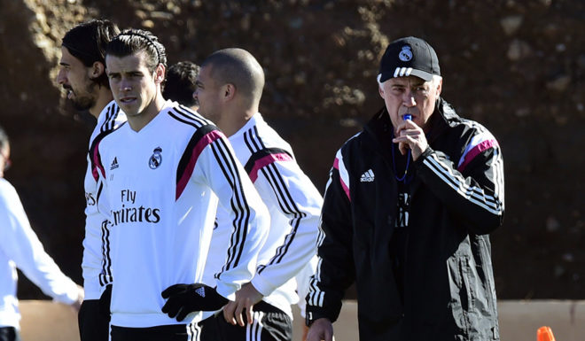 Real Madrid's Italian coach Carlo Ancelotti (R), Welsh forward Gareth Bale (C) and Colombian midfielder James Rodriguez take part in a training session on December 18, 2014 in the Moroccan city of Marrakesh, two days ahead of their FIFA Club World Cup final football match against San Lorenzo. AFP PHOTO/ JAVIER SORIANO (Photo credit should read JAVIER SORIANO/AFP/Getty Images)