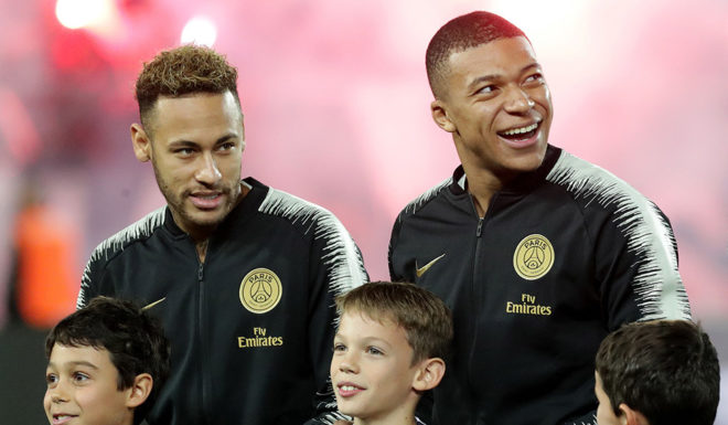 (LtoR) Paris Saint-Germain's Brazilian forward Neymar, Paris Saint-Germain's French forward Kylian Mbappe and Paris Saint-Germain's German defender Thilo Kehrer stand on the pitch prior to the French L1 football match Bordeaux vs Paris Saint-Germain (PSG), on December 2, 2018 in Bordeaux, southwestern France. (Photo by ROMAIN PERROCHEAU / AFP) (Photo credit should read ROMAIN PERROCHEAU/AFP/Getty Images)