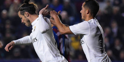 Real Madrid's Welsh forward Gareth Bale (L) celebrates with Real Madrid's Spanish midfielder Lucas Vazquez after scoring a goal during the Spanish league football match between Levante UD and Real Madrid CF at the Ciutat de Valencia stadium in Valencia on February 24, 2019. (Photo by JOSE JORDAN / AFP) (Photo credit should read JOSE JORDAN/AFP/Getty Images)