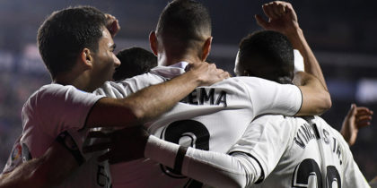 Real Madrid's French forward Karim Benzema (C) celebrates with teammates after scoring a goal during the Spanish league football match between Levante UD and Real Madrid CF at the Ciutat de Valencia stadium in Valencia on February 24, 2019. (Photo by JOSE JORDAN / AFP) (Photo credit should read JOSE JORDAN/AFP/Getty Images)