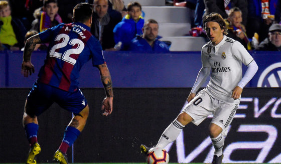 Levante's Spanish defender Antonio Luna (L) challenges Real Madrid's Croatian midfielder Luka Modric during the Spanish league football match between Levante UD and Real Madrid CF at the Ciutat de Valencia stadium in Valencia on February 24, 2019. (Photo by JOSE JORDAN / AFP) (Photo credit should read JOSE JORDAN/AFP/Getty Images)