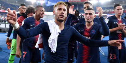 Paris Saint-Germain's Brazilian forward Neymar celebrates with team mates and supporters after scoring four goals and winning the French L1 football match between Paris Saint-Germain (PSG) and Olympique de Lyon (OL) on October 7, 2018 at the Parc des Princes stadium in Paris. (Photo by FRANCK FIFE / AFP) (Photo credit should read FRANCK FIFE/AFP/Getty Images)