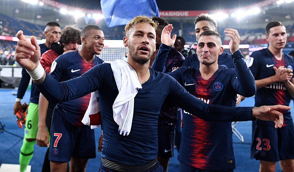 Paris Saint-Germain's Brazilian forward Neymar celebrates with team mates and supporters after scoring four goals and winning the French L1 football match between Paris Saint-Germain (PSG) and Olympique de Lyon (OL) on October 7, 2018 at the Parc des Princes stadium in Paris. (Photo by FRANCK FIFE / AFP) (Photo credit should read FRANCK FIFE/AFP/Getty Images)