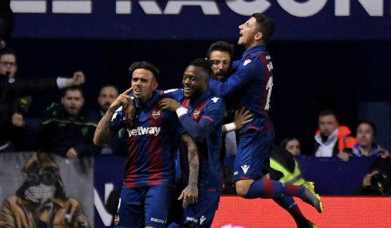 Levante's Spanish forward Roger Marti (L) celebrates with teammates after scoring a goal during the Spanish league football match between Levante UD and Real Madrid CF at the Ciutat de Valencia stadium in Valencia on February 24, 2019. (Photo by JOSE JORDAN / AFP) (Photo credit should read JOSE JORDAN/AFP/Getty Images)