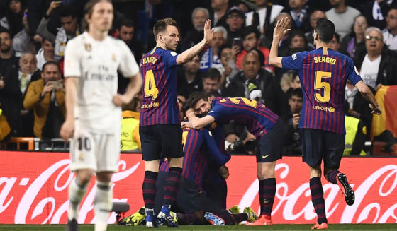 Barcelona players celebrate their opening goal during the Spanish Copa del Rey (King's Cup) semi-final second leg football match between Real Madrid and Barcelona at the Santiago Bernabeu stadium in Madrid on February 27, 2019. (Photo by OSCAR DEL POZO / AFP) (Photo credit should read OSCAR DEL POZO/AFP/Getty Images)