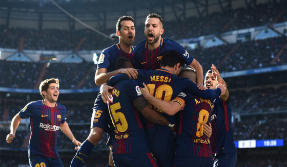 MADRID, SPAIN - DECEMBER 23: Lionel Messi of Barcelona celebrates after scoring his sides second goal with his team mates during the La Liga match between Real Madrid and Barcelona at Estadio Santiago Bernabeu on December 23, 2017 in Madrid, Spain. (Photo by Denis Doyle/Getty Images)