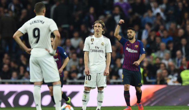 MADRID, SPAIN - FEBRUARY 27: Luka Modric and Karim Benzema of Real Madrid react as Luis Suarez of FC Barcelona celebrates his team's third goal during the Copa del Rey Semi Final second leg match between Real Madrid and FC Barcelona at Bernabeu on February 27, 2019 in Madrid, Spain. (Photo by Denis Doyle/Getty Images)