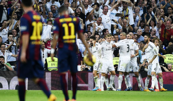 Real Madrid's French forward Karim Benzema (3rd R) celebrates his goal with teammates during the Spanish league "Clasico" football match Real Madrid CF vs FC Barcelona at the Santiago Bernabeu stadium in Madrid on October 25, 2014. Real Madrid won 3-1. AFP PHOTO/ GERARD JULIEN (Photo credit should read GERARD JULIEN/AFP/Getty Images)
