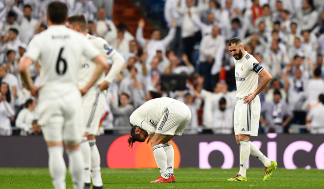 Real Madrid Real Madrid's French forward Karim Benzema (R) looks at Real Madrid's Welsh forward Gareth Bale as he reacts in pain during the UEFA Champions League round of 16 second leg football match between Real Madrid CF and Ajax at the Santiago Bernabeu stadium in Madrid on March 5, 2019. (Photo by GABRIEL BOUYS / AFP) (Photo credit should read GABRIEL BOUYS/AFP/Getty Images)