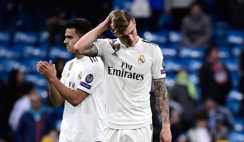 Real Madrid's German midfielder Toni Kroos (R) and Real Madrid's Spanish defender Sergio Reguilon react at the end of the UEFA Champions League round of 16 second leg football match between Real Madrid CF and Ajax at the Santiago Bernabeu stadium in Madrid on March 5, 2019. (Photo by JAVIER SORIANO / AFP) (Photo credit should read JAVIER SORIANO/AFP/Getty Images)